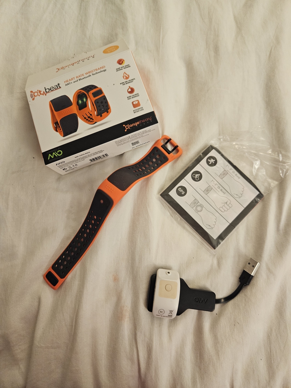 Orangetheory Perforated Silicone Heart Rate Wristband in Orange and Black